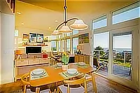 Dining area with large windows overlooking the ocean