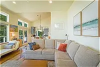 Living room with sectional sofa and large windows
