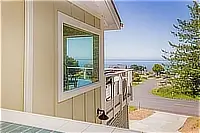 Ocean view from a cottage window overlooking the neighborhood